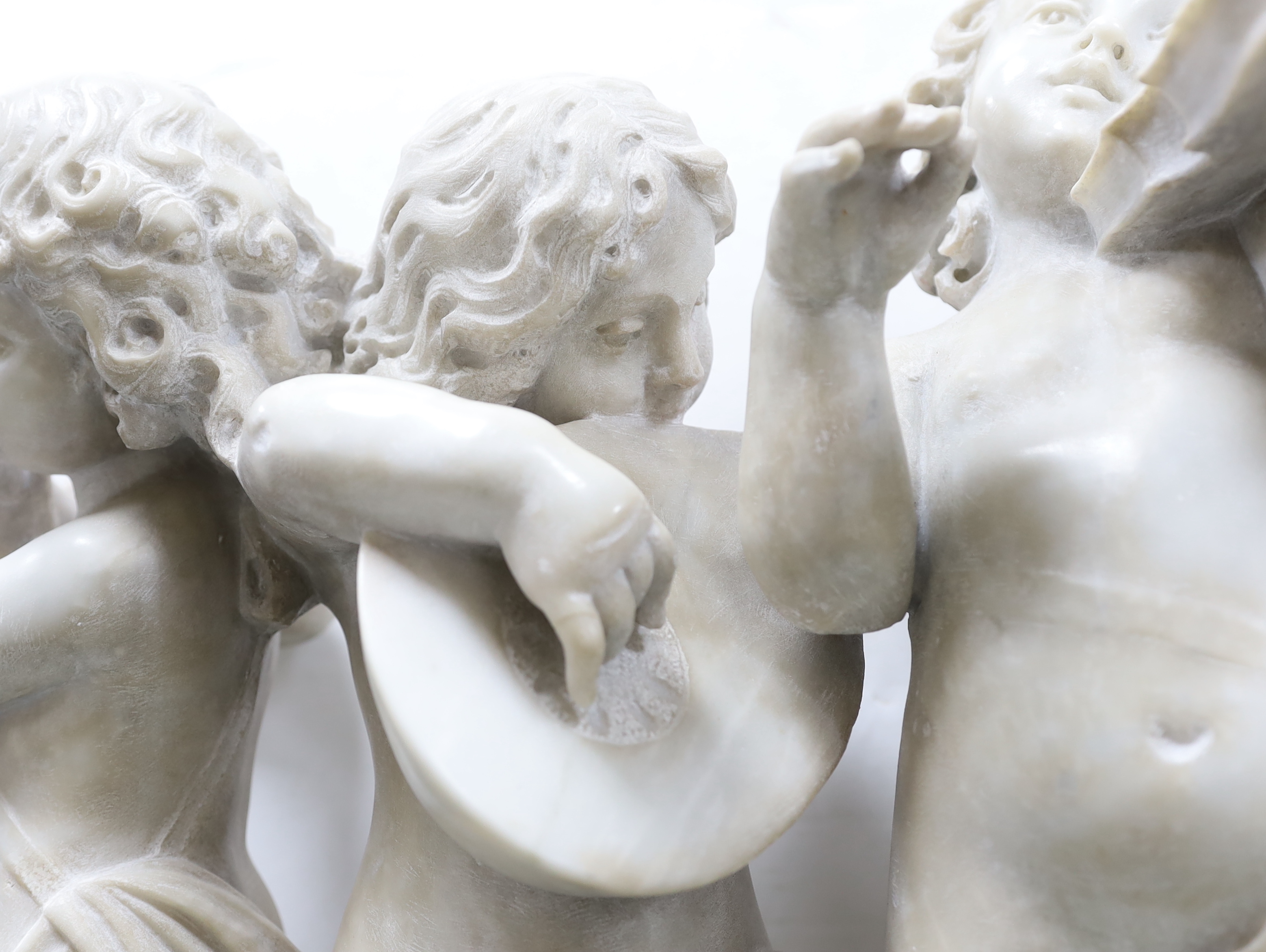 After the Ferdinando Vichi Gallery. An Italian white Carrara marble group 'Musica', Please note this lot attracts an additional import tax of 5% on the hammer price